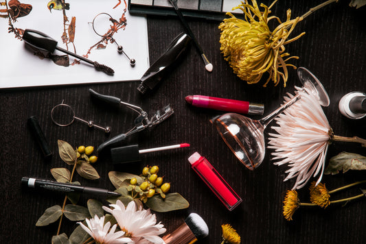 Everyday beauty items arranged on a light surface