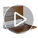 Home Aesthetics 18" ADA Compliant Wall-Mounted Folding Serena Teak Wood Shower Bench Seat with Matte Black Frame, Clear Co...