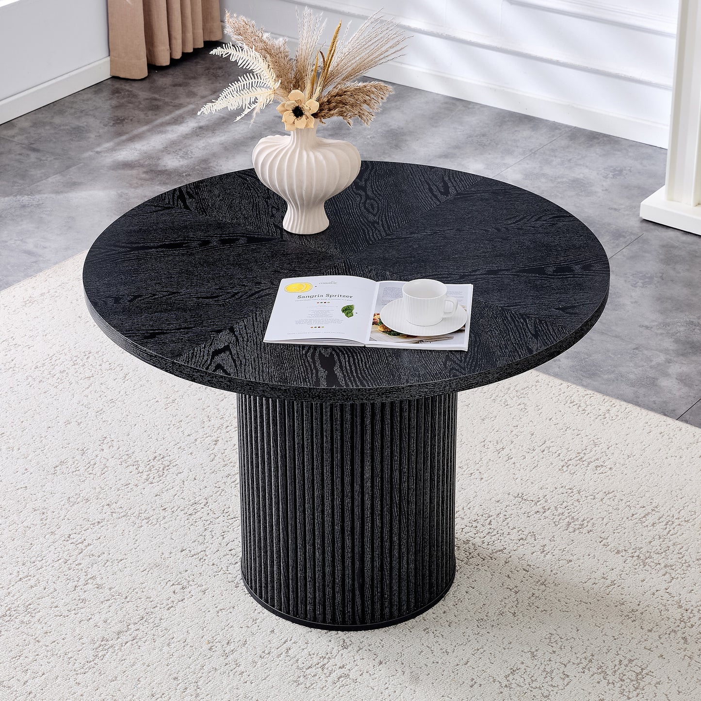 A Modern Spliced Circular Dining Table With A Diameter Of 42 Inches, Featuring Black Wood Color Textures Fan-shaped Diagonal Color Splicing Board Design, Interpreting Home Aesthetics And Practicality.