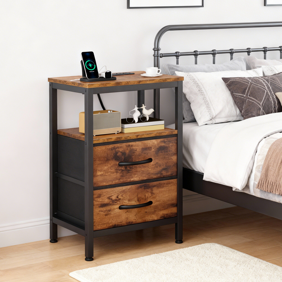 A Small Bedside Table With A Charging Station And Two Fabric Drawers, And A Side Bedside Table