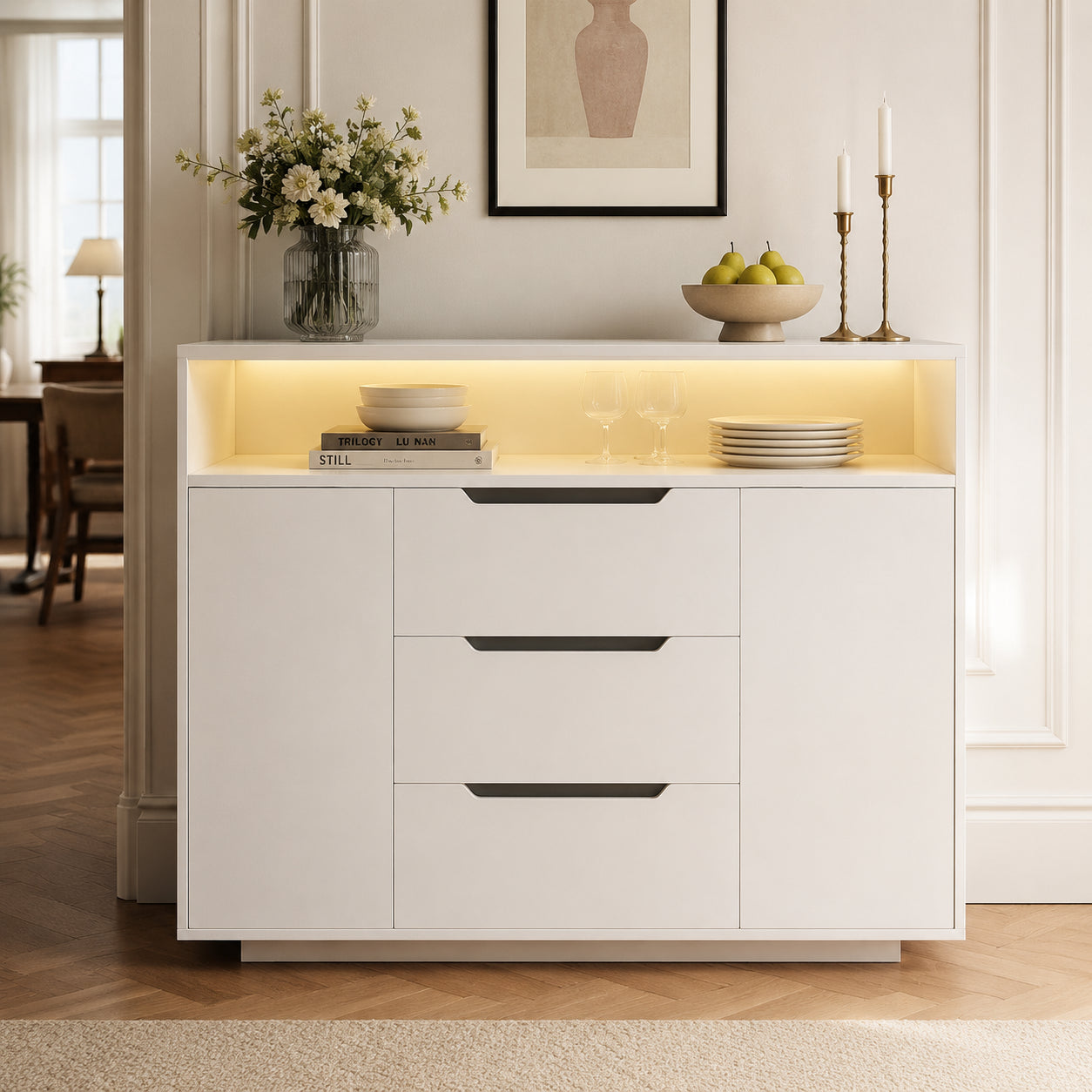 Modern White Multifunctional Cabinet With Open Shelf, Three Drawers And Doors On Both Sides. White Matt Look With Metal Rails And Rounded Edges. Ideal For Living Room, Dining Area Or Office.