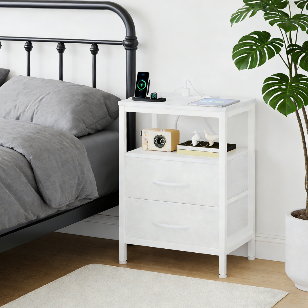 A Small Bedside Table With A Charging Station And Two Fabric Drawers, And A Side Bedside Table
