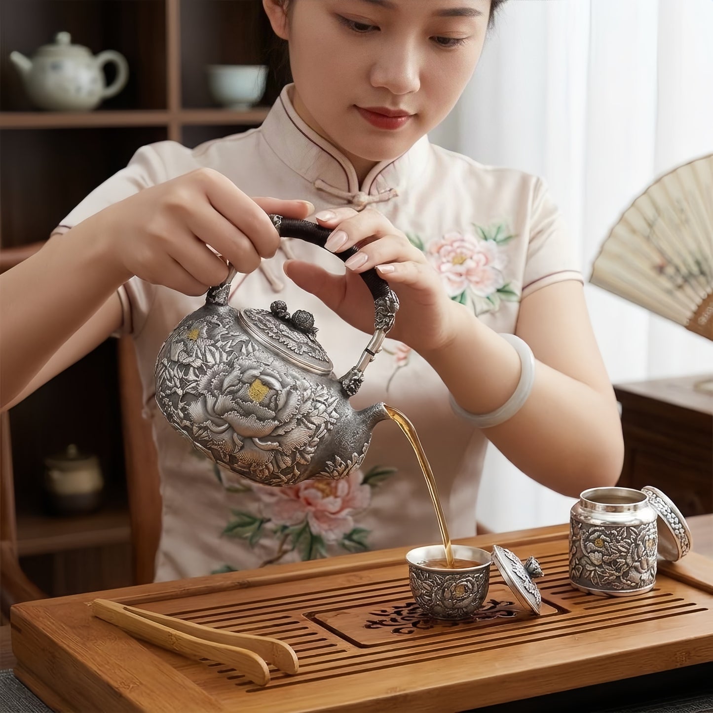 Pure 999 Fine Silver Handcrafted Silver Tea Kettle Featuring Intricate Peony Relief and Woven Handle - Handicraft